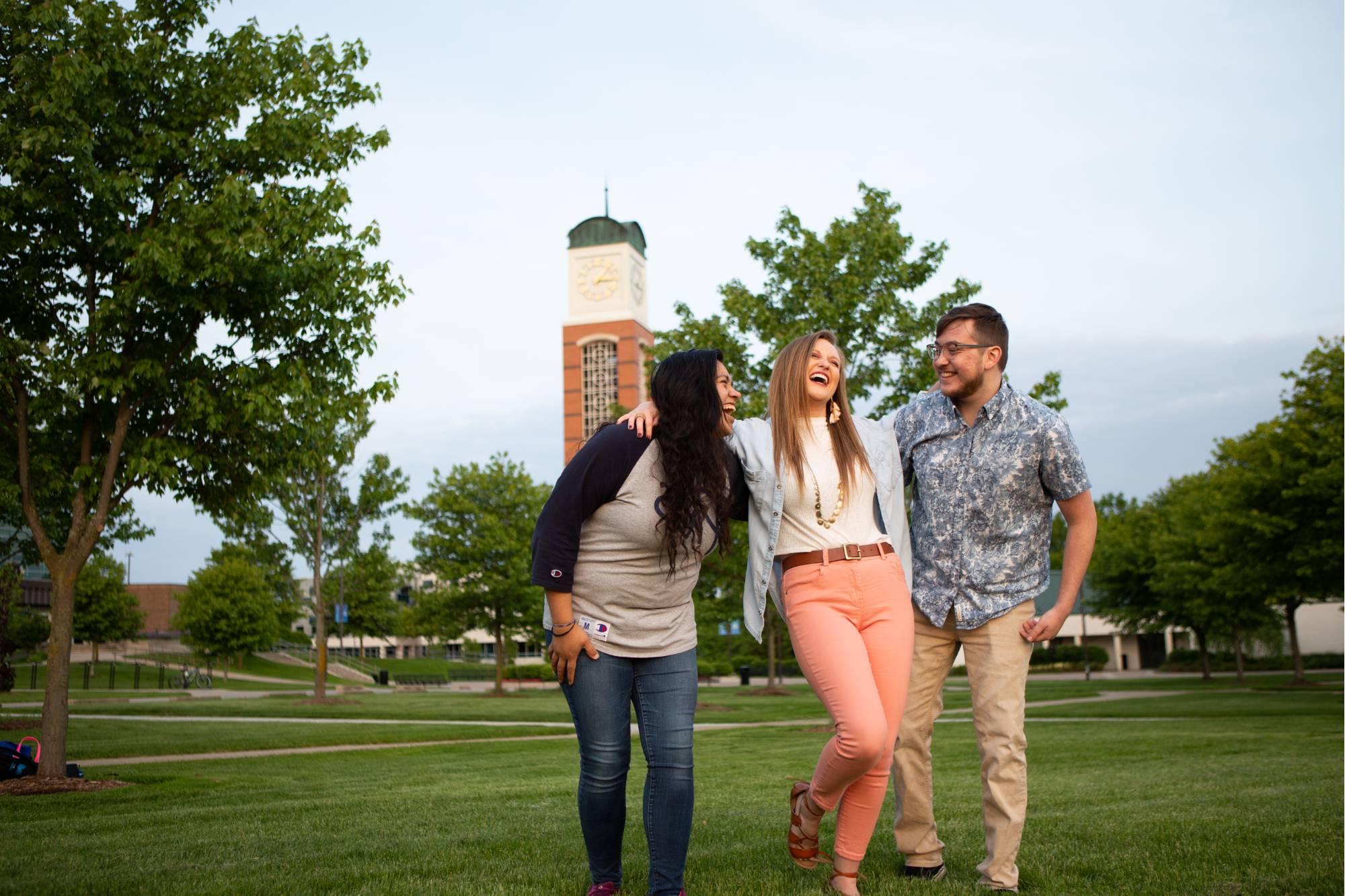 Three students near the cook-carillon tower.